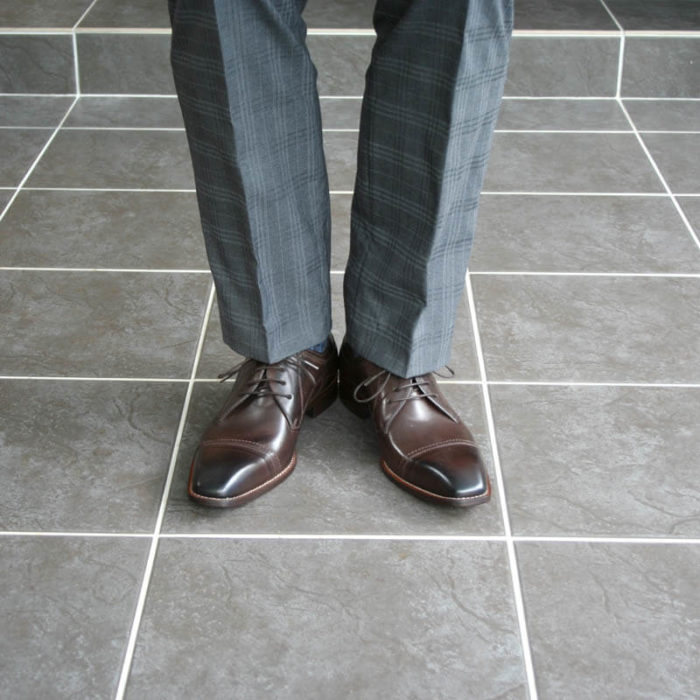 Photo men`s business shoes-Sophisticated design-dark brown mocha tone-2 shoes gray suit legs front view